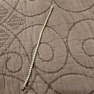 Sterling Silver and faux diamond tennis braclet.